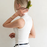 Woman with extra thick hair styling an updo using the VESITIA Maison Jumbo Claw Clip in Verde.