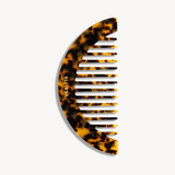 Tortoiseshell VESITIA hair comb with on a white background