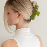 Woman with extra thick hair styling an updo using the VESITIA Maison Jumbo Claw Clip in Verde.