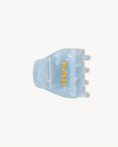 Blue hair clip with 'VESITIA' branding on a white background