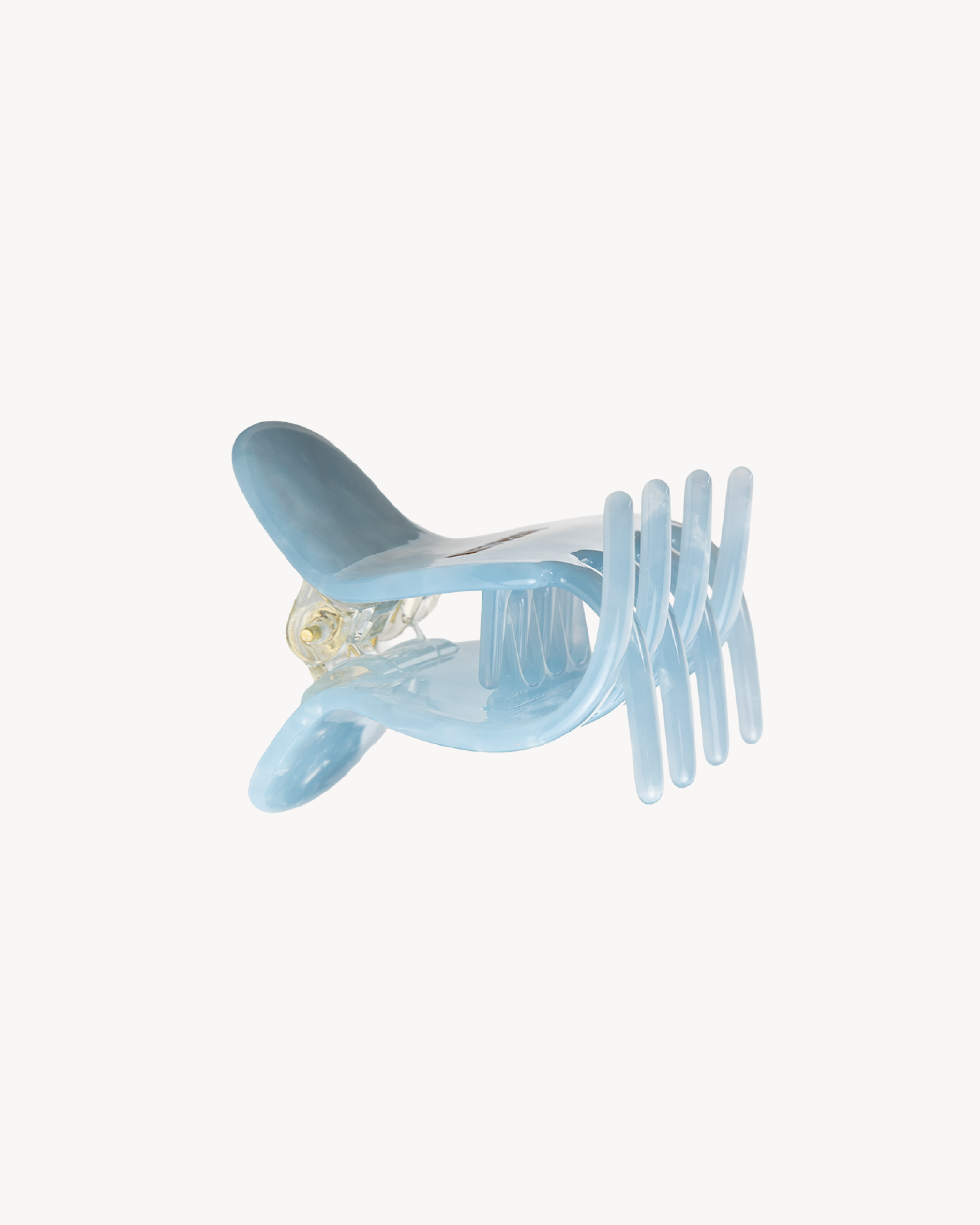 Light blue VESITIA hair claw clip on a white background