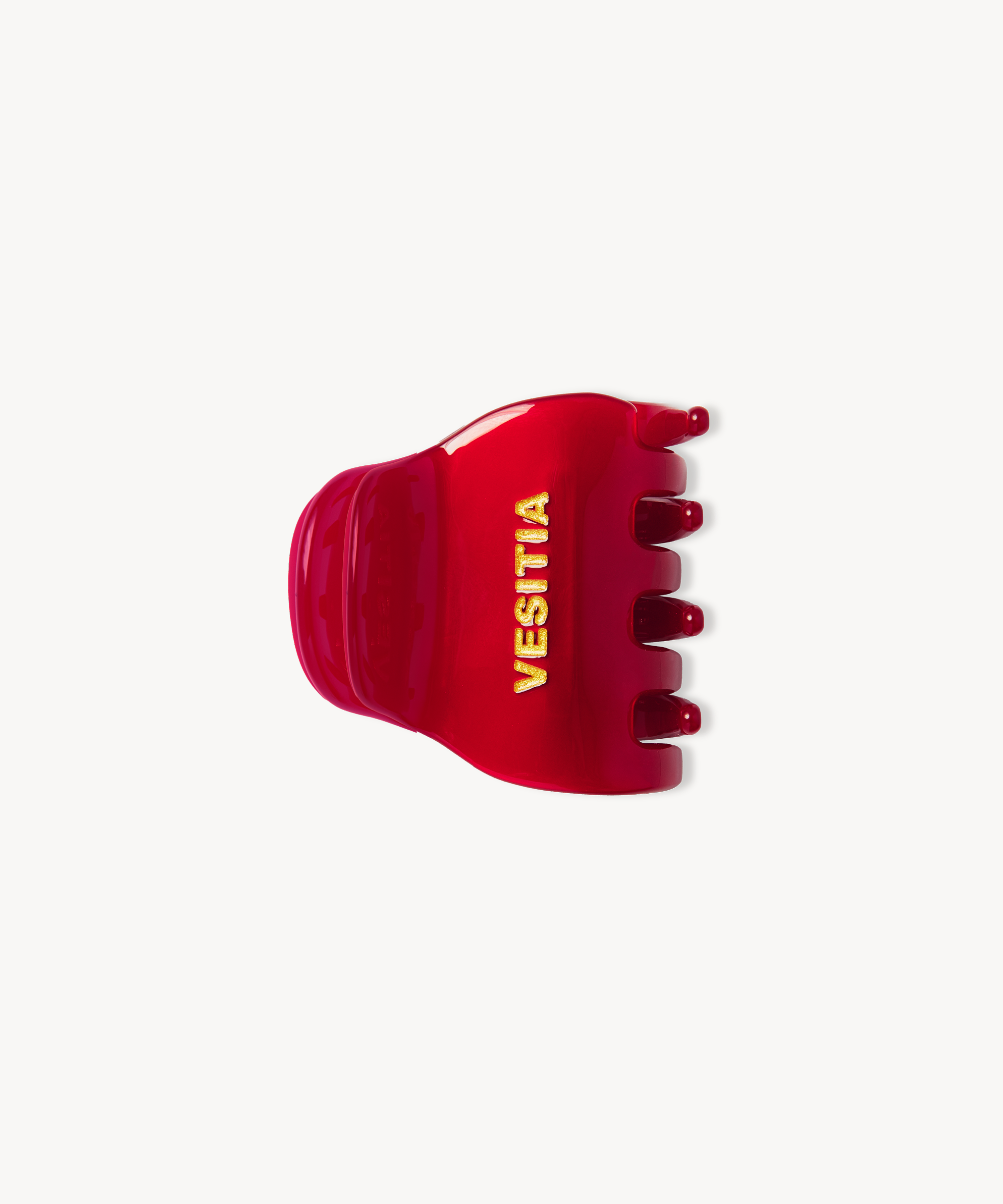 Red VESITIA midi claw clip on a white background