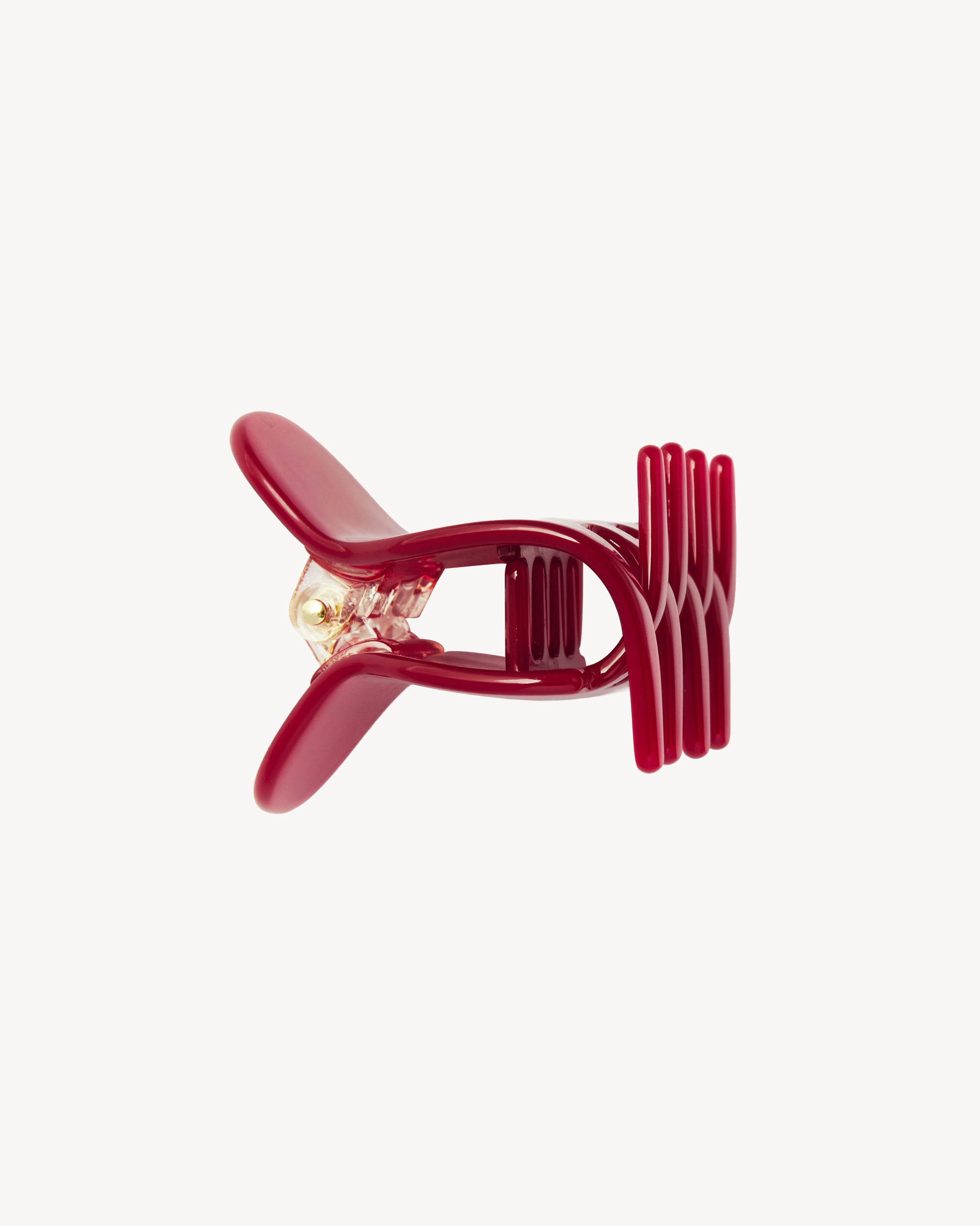 Red VESITIA midi claw clip on a white background