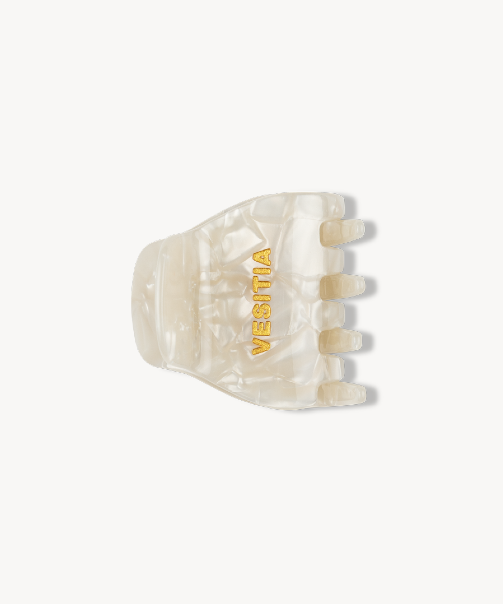 White hair claw clip with 'VESITIA' branding on a white background