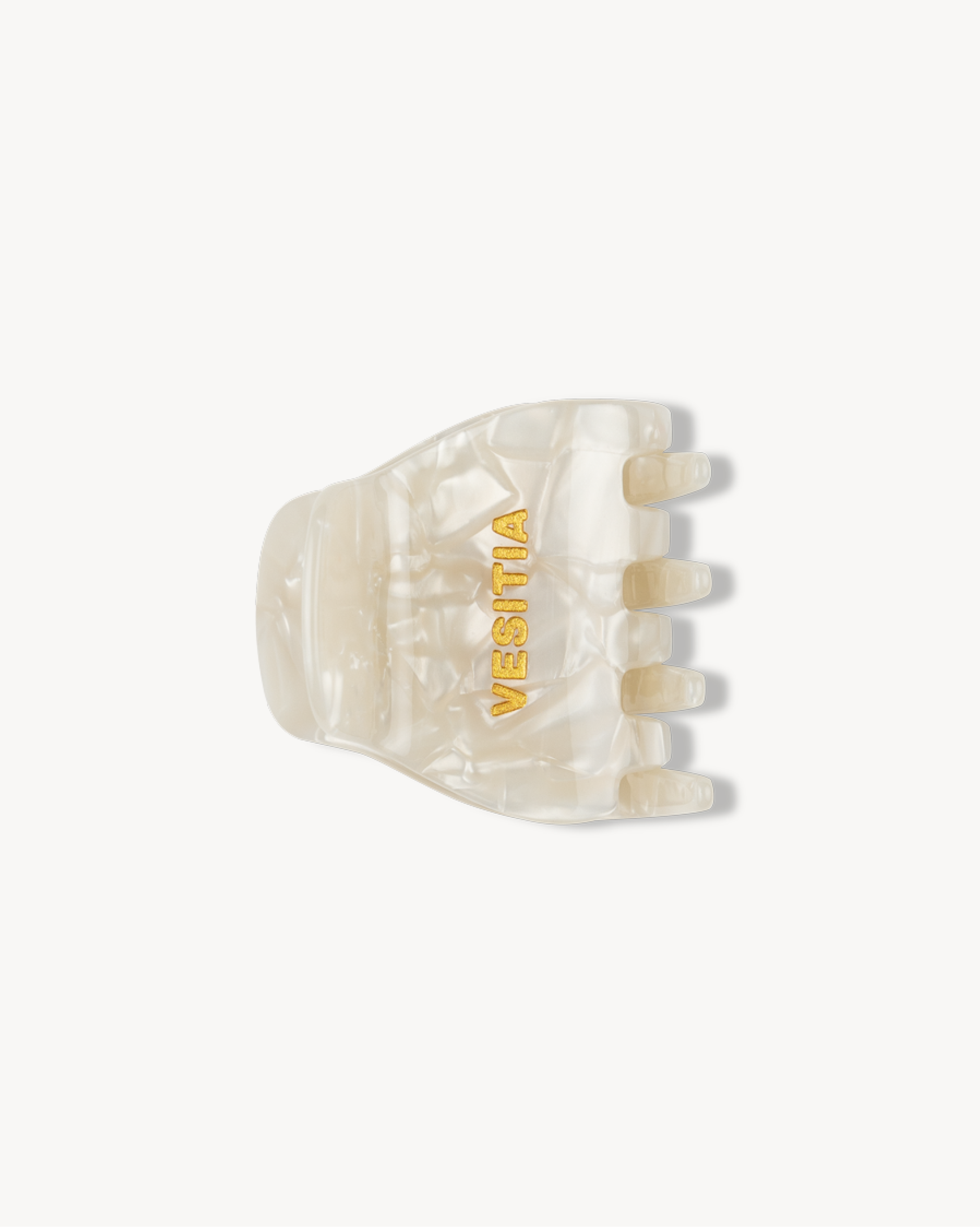 White hair claw clip with 'VESITIA' branding on a white background