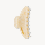 Beige VESITIA hair claw clip with a textured design on a white background