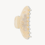 Beige VESITIA hair claw clip for mums with textured design on a white background