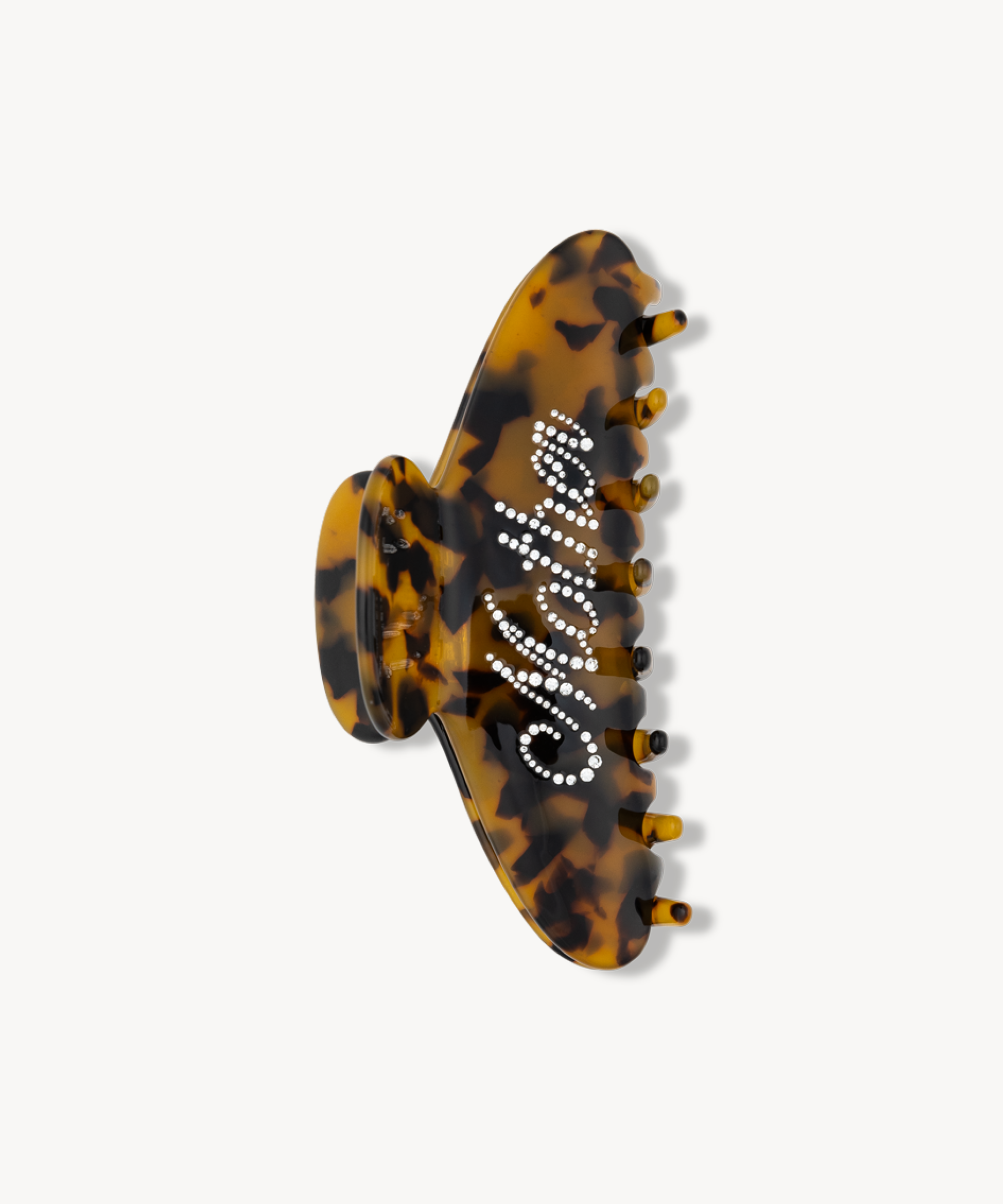 Tortoiseshell patterned VESITIA mother claw clip on a white background