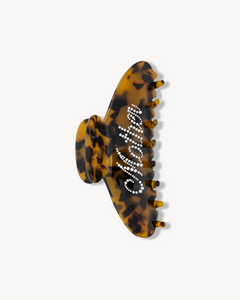 Tortoiseshell patterned VESITIA mother claw clip on a white background