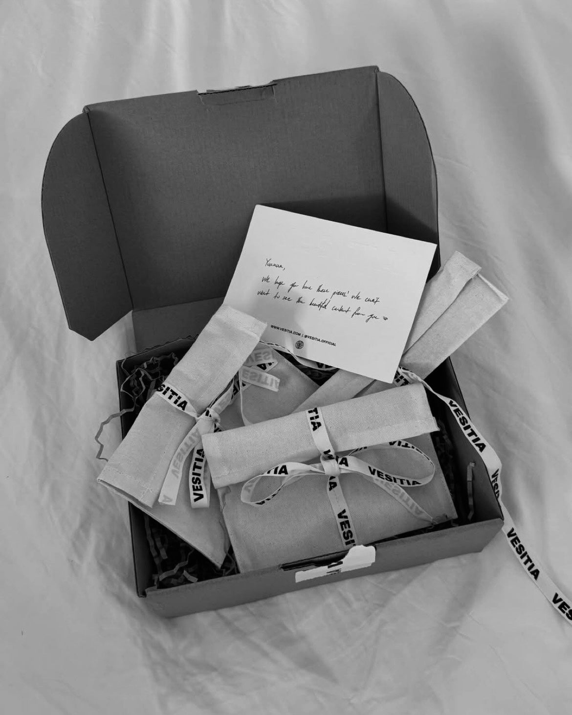 A box of VESITIA products with a thank you card on a light background