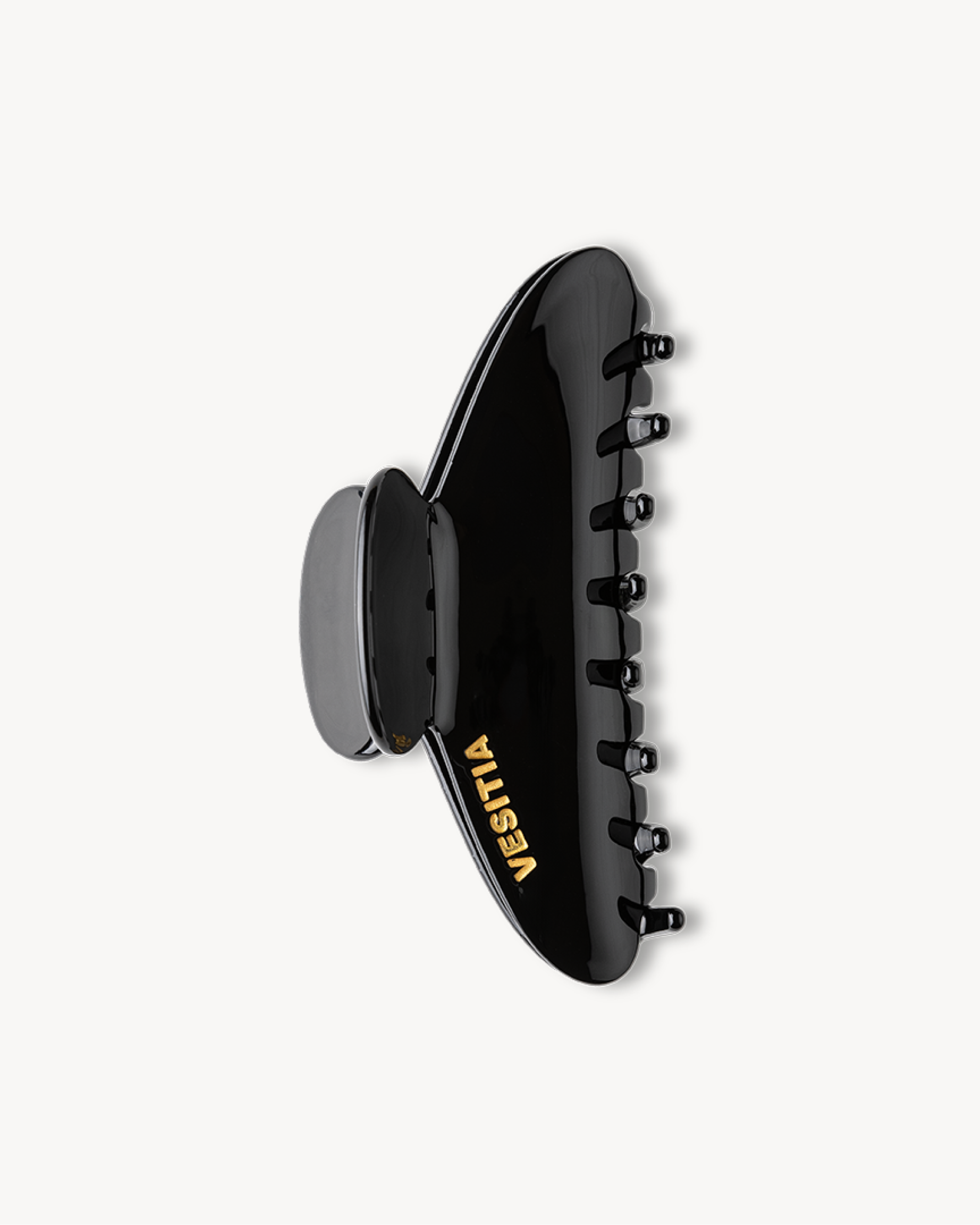 Black VESITIA hair claw clip on a white background