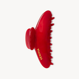 A glossy red hair claw clip with the brand name 'VESITIA' painted in gold, shown against a plain off-white background.