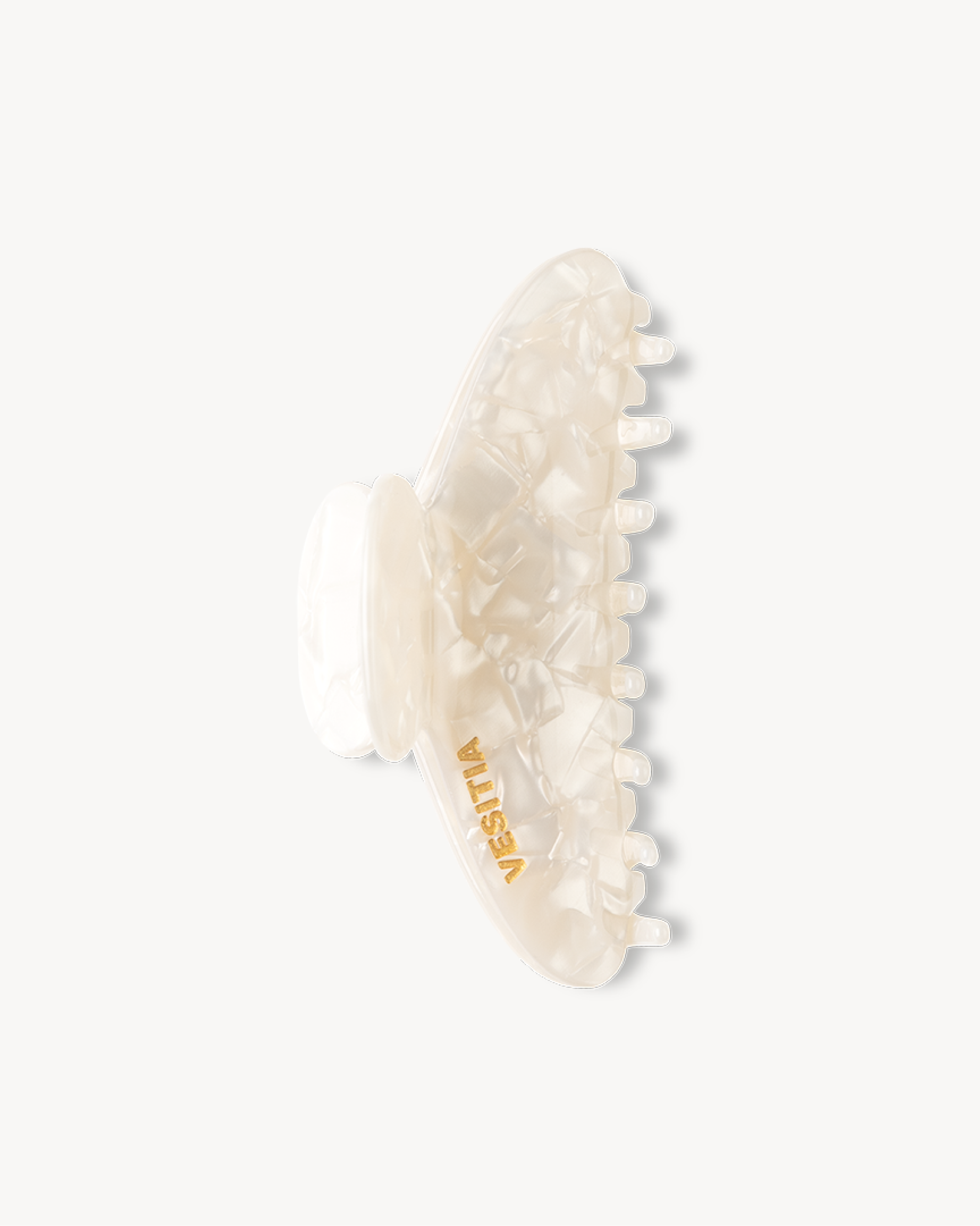 White VESITIA hair claw clip on a white background