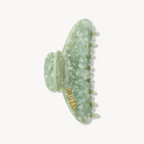 Green VESITIA signature claw clip on a white background